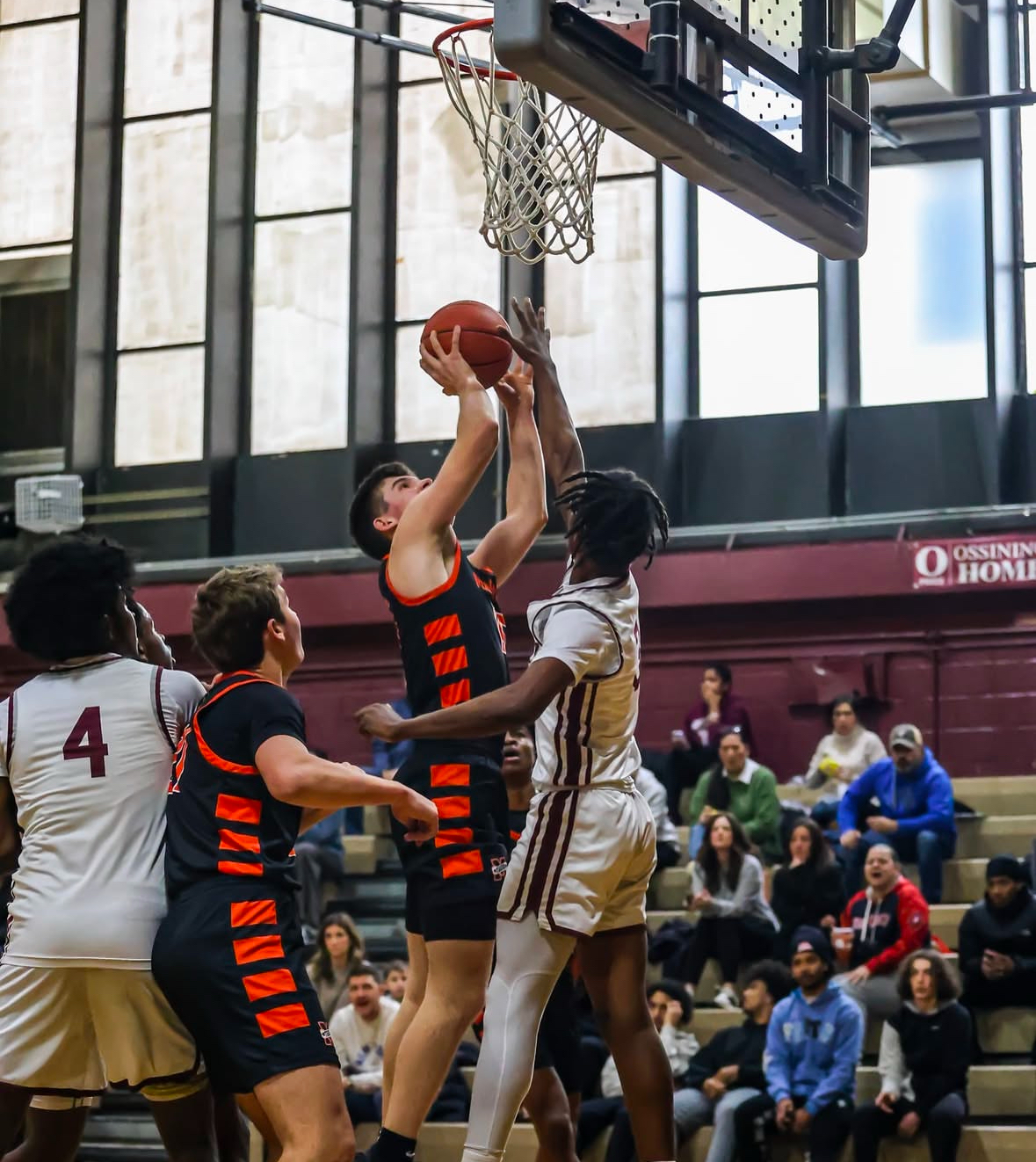 Will Plunket ('26) shooting a basket at the Tiger's game against OHS. 